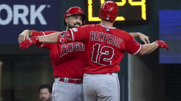 Jun 13, 2023; Arlington, Texas, USA; Los Angeles Angels right fielder Hunter Renfroe (12) celebrates with Los Angeles Angels third baseman Anthony Rendon (6) after hitting a home run during the sixth inning against the Texas Rangers at Globe Life Field. Mandatory Credit: Kevin Jairaj-USA TODAY Sports  